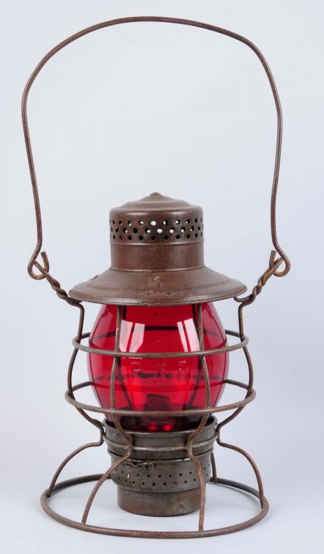 Rayo Kerosene Lantern.: No. 29 WB. Appears complete with Pennsylvania railroad ruby glass shade. Condition (Excellent). Size 10 - 1/2" T.