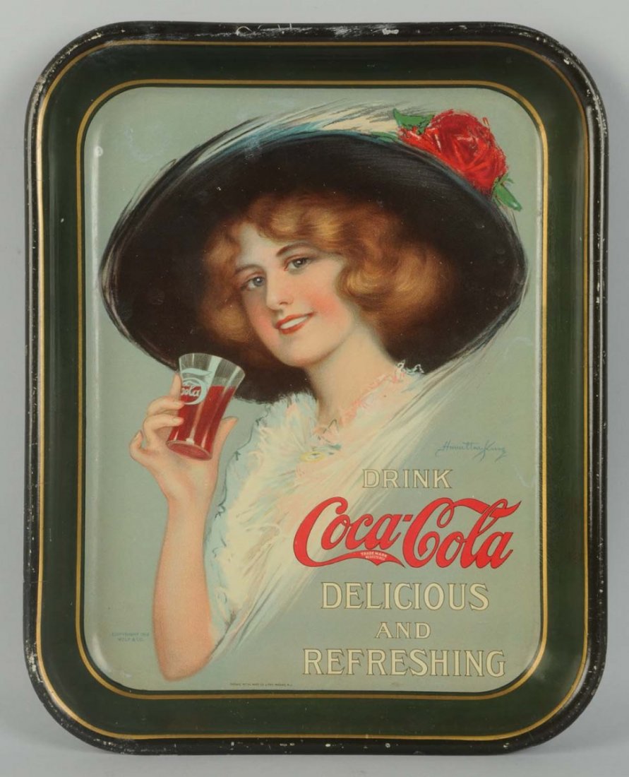 1913 Coca-Cola Serving Tray.: A few spots and gloss differences on tray face, rim nicks. Condition (Very Good). Size 13 - 1/4" x 10 - 1/2".