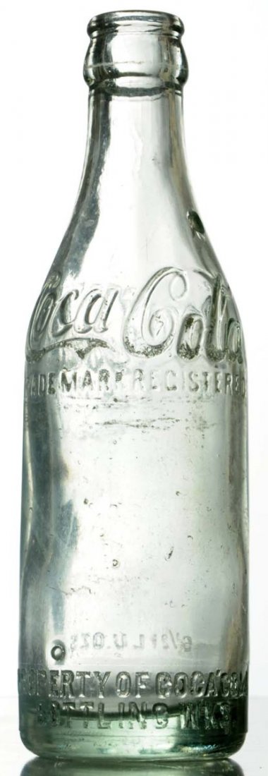 Belzoni, Mississippi Coca-Cola Bottle.: Chip in neck and logo lettering nicking and abrasions. Condition (Very Good). Size 7 - 3/4" T.