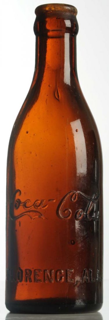 Florence, Alabama Amber Coca-Cola Bottle.: Lip chips and light wear otherwise. Condition (Very Good). Size 7 - 1/4" T.