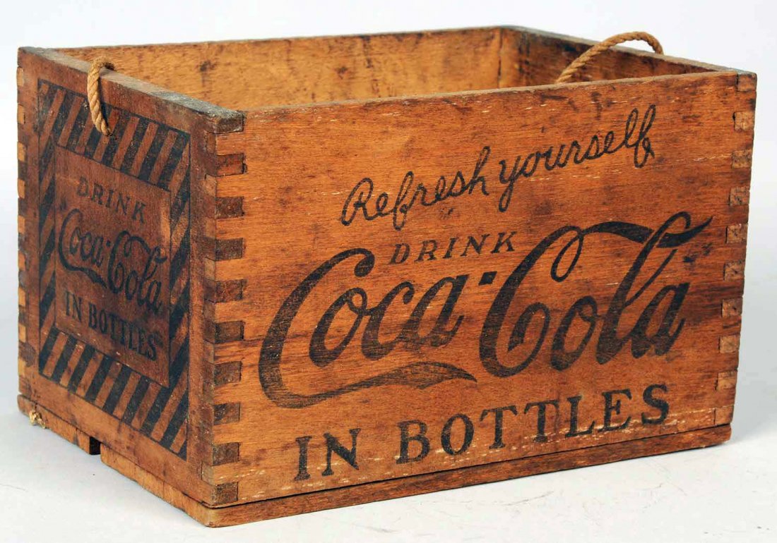 1920s Coca-Cola Wooden Dovetailed Carrier.: Strong color on all four sides with original rope handle and light soiling only. Condition (Excellent Plus). Size 5" x 8" x 5 - 1/2".