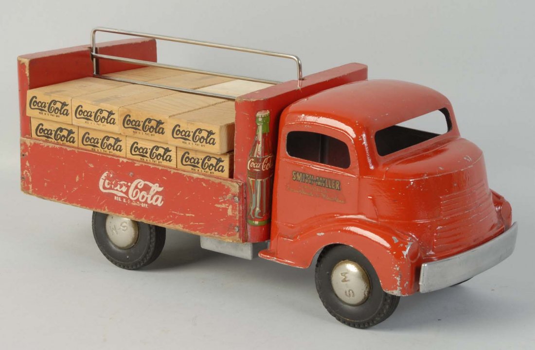 1940's Wood & Metal Smith-Miller Coca-Cola Truck.: The wooden cases are reproductions but display well. Moderate wear with decal loss on drivers side cargo panel. Back panel has non-original screw and nail. Condition (Very Good). Size 13 - 1/4" L.