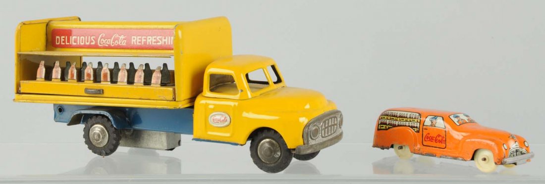 Lot of 2: 1950s Coca-Cola Trucks.: Light wear on larger truck with a missing bottle rack display on one side. Surface rust and pitting on the small Italian truck. Condition (Very Good - Excellent). Size Largest: 8" L.