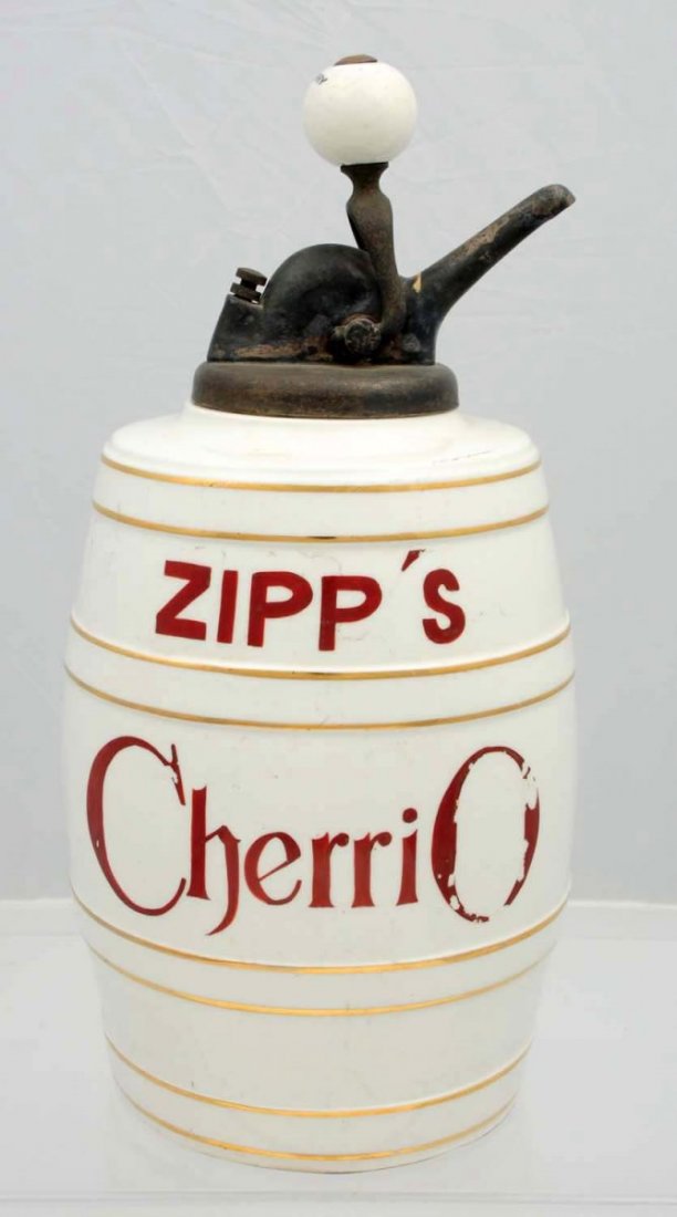 Zipp’s Cherrio Barrel Syrup Dispenser.: Very sound display piece with bright gloss and strong gold. The red lettering exhibits some color loss/chipping, and nearly no wear is seen anywhere else. An old pump marked Cherry on the ball complim