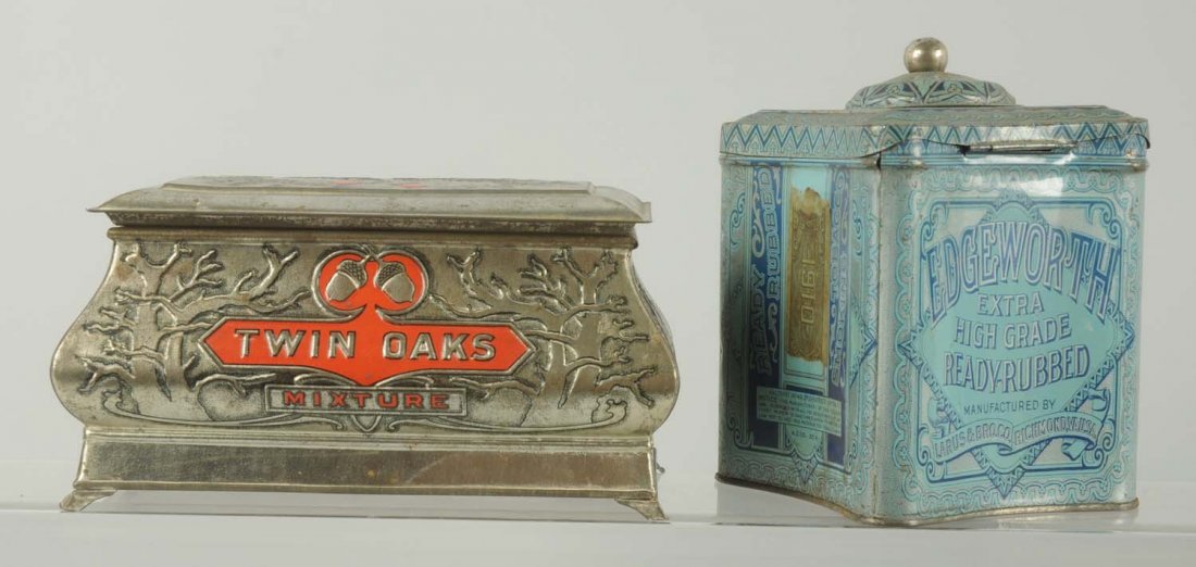 Lot of 2: Tobacco Canisters.: Includes a Twin Oaks embossed casket shaped tin. Not seen very often. Very little overall wear. Also an Edgeworth Concave canister. Has general overall wear. Condition (Very Good). Size Largest: 8 - 1