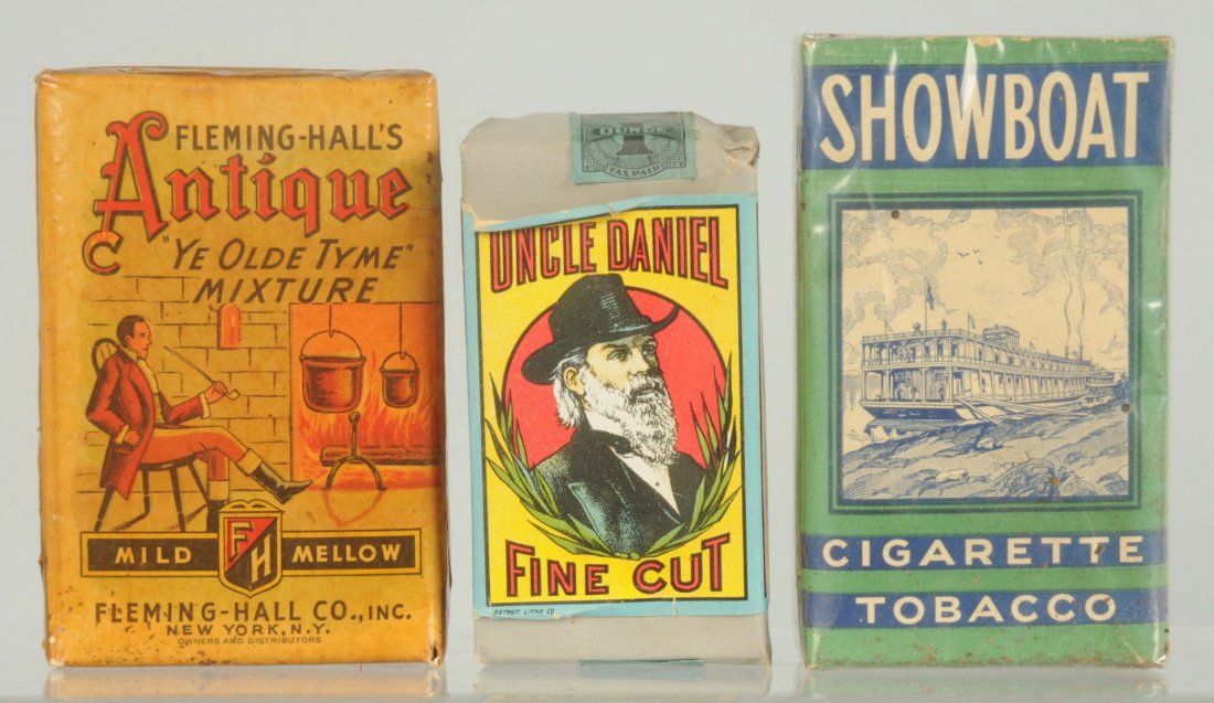 Lot of 3: Tobacco Packs.: Includes Uncle Daniel, Show Boat, Antique Old Time Mixture. Nice grouping. Good detail. Minimal overall wear. A tad of age toning. Condition (Excellent). Size Largest: 4" T.