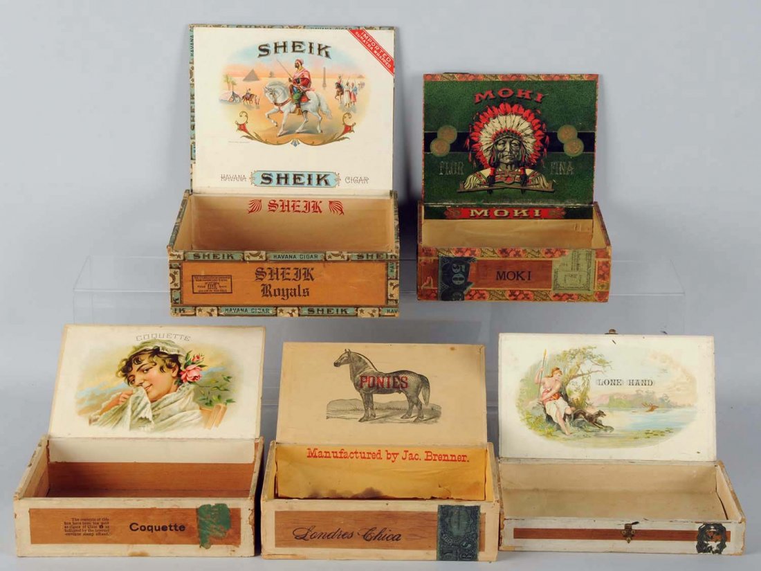 Lot of 5: Assorted Cigar Boxes.: Pre-1900 to 1930. Lone Hand, Ponies (Manufacturer Jac. Brenner), Sheik, Coquette, and Moki (picturing Indian Chief). Condition (Very Good). Size Largest: 8 - 1/2" x 7".