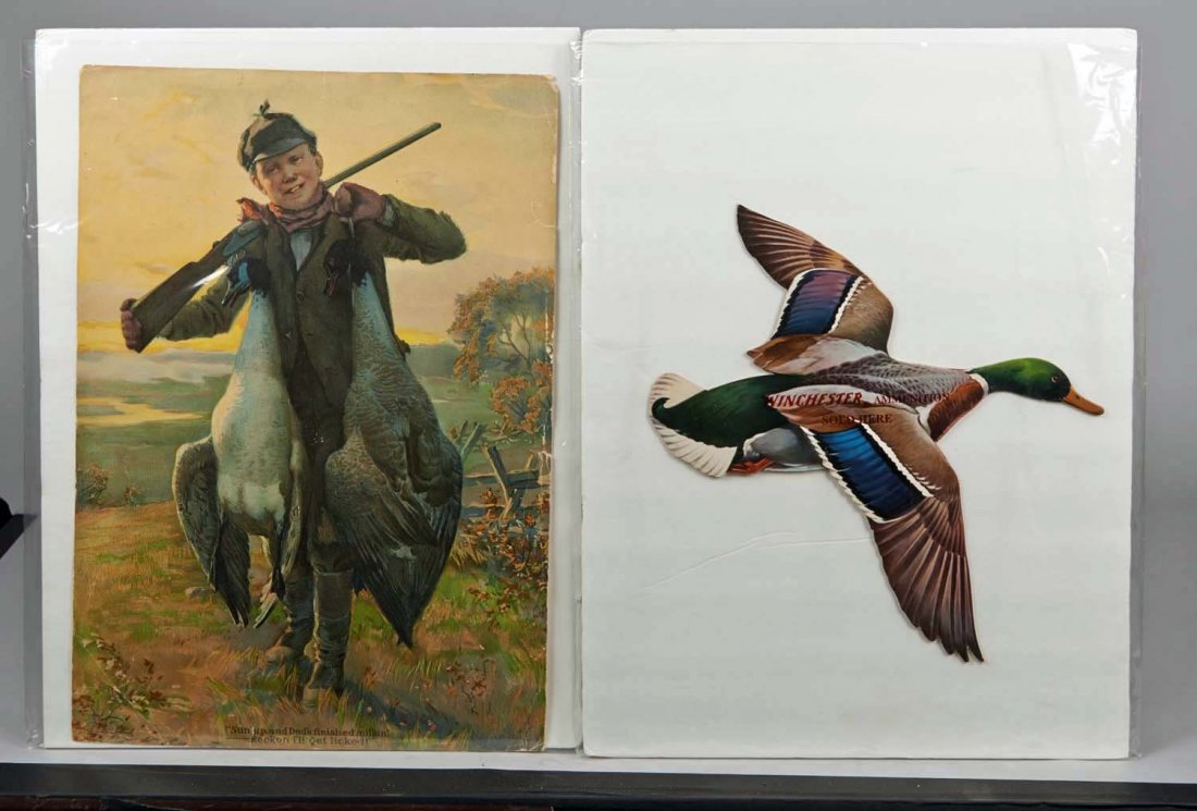Lot of 2 Vintage Firearms Hunting Advertisements.: Lot includes: a paper advertisement "Sun up, and Dad's finished milkin'. Reckon I'll Get Licked!" featuring boy with two fat geese and shotgun, has some wear around edges and a "Winchester Ammunition 