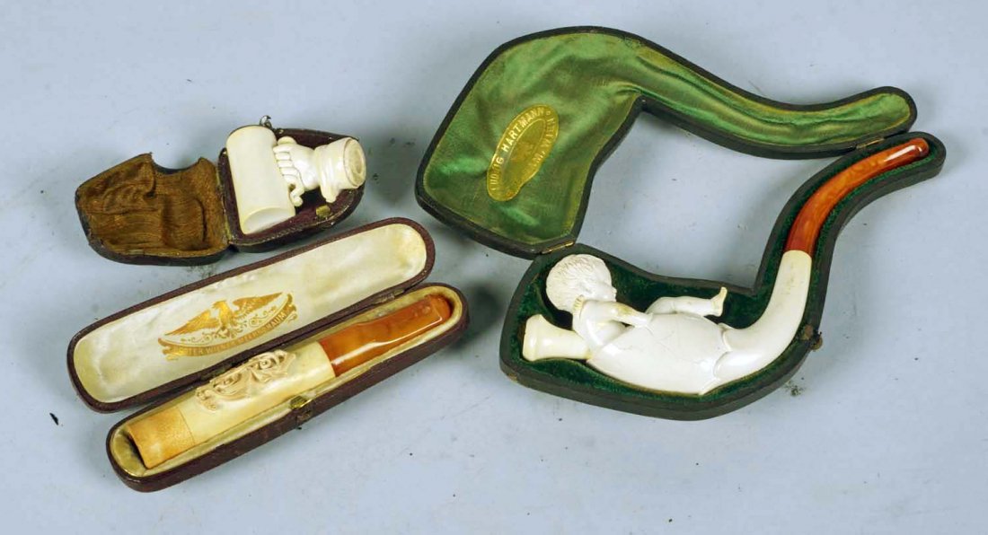 Lot of 3: Pipes with Cases.: Lot includes: a meerschaum cherub in egg pipe with removable bowl insert in case marked "Ludwig Hartmann & Eidam, Wien", a meerschaum monogrammed cigarette holder in case marked "Bester Wiener Meersch