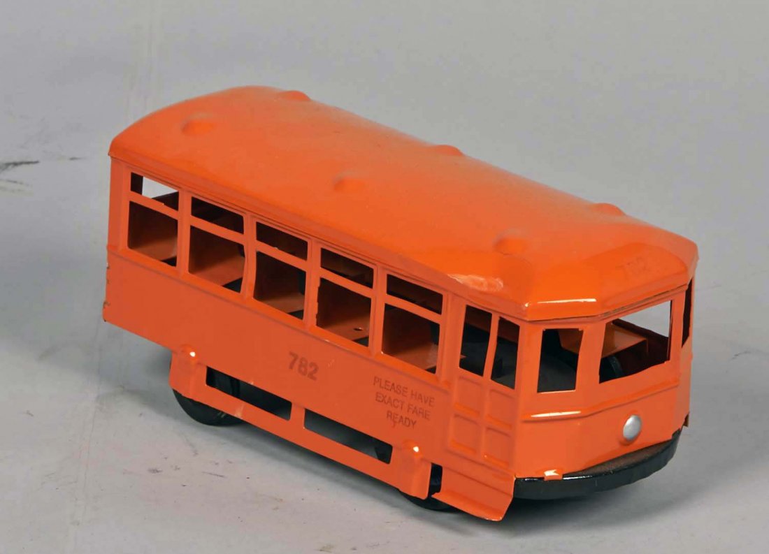 Kingsbury Tinplate Wind-Up Trolley: Orange with "782" and "Please Have Exact Fare Ready" markings. Has Kingsbury Toys tires. Condition (Excellent) Size 9" L.