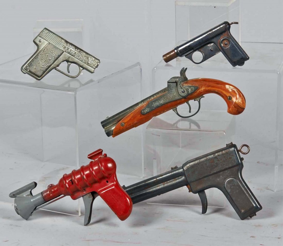 Lot Of 5 Toy Guns: Cap or Water Guns: 1 - Daisy No. 72 Squirt-O-Matic combination water & noise pistol, Daisy MFG. Co. Plymouth, Mich. USA, 1 - Hubley Flintlock double-hammer ornate engraved marbleized plastic & die-cast metal cap gun, 1