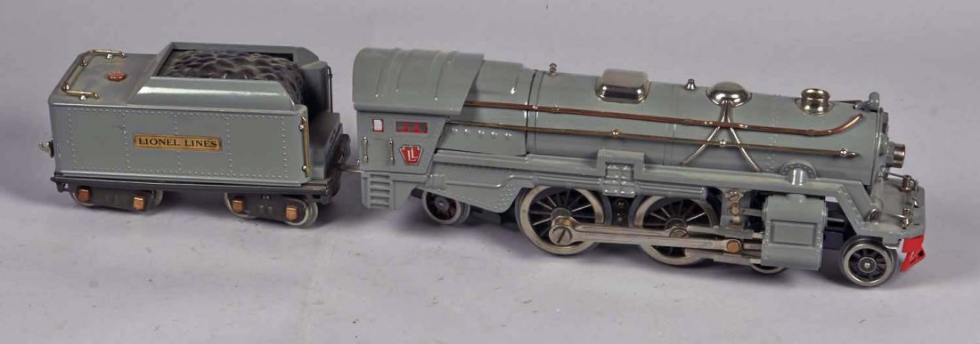 Lionel Standard Gauge Electric 392 Locomotive: Includes 392E engine and tender car. Both grey with gold details. Condition (Excellent). Size Approx. 25" L. when attached