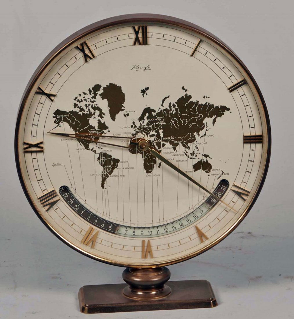 Kienzle German Quartz Round Wind-Up World Clock: Brass frame & base w/ glass cover & Roman numerals, Featuring map of the world in gold w/ times zones dial, Made in Germany Condition Excellent Size 10" x 11.5"