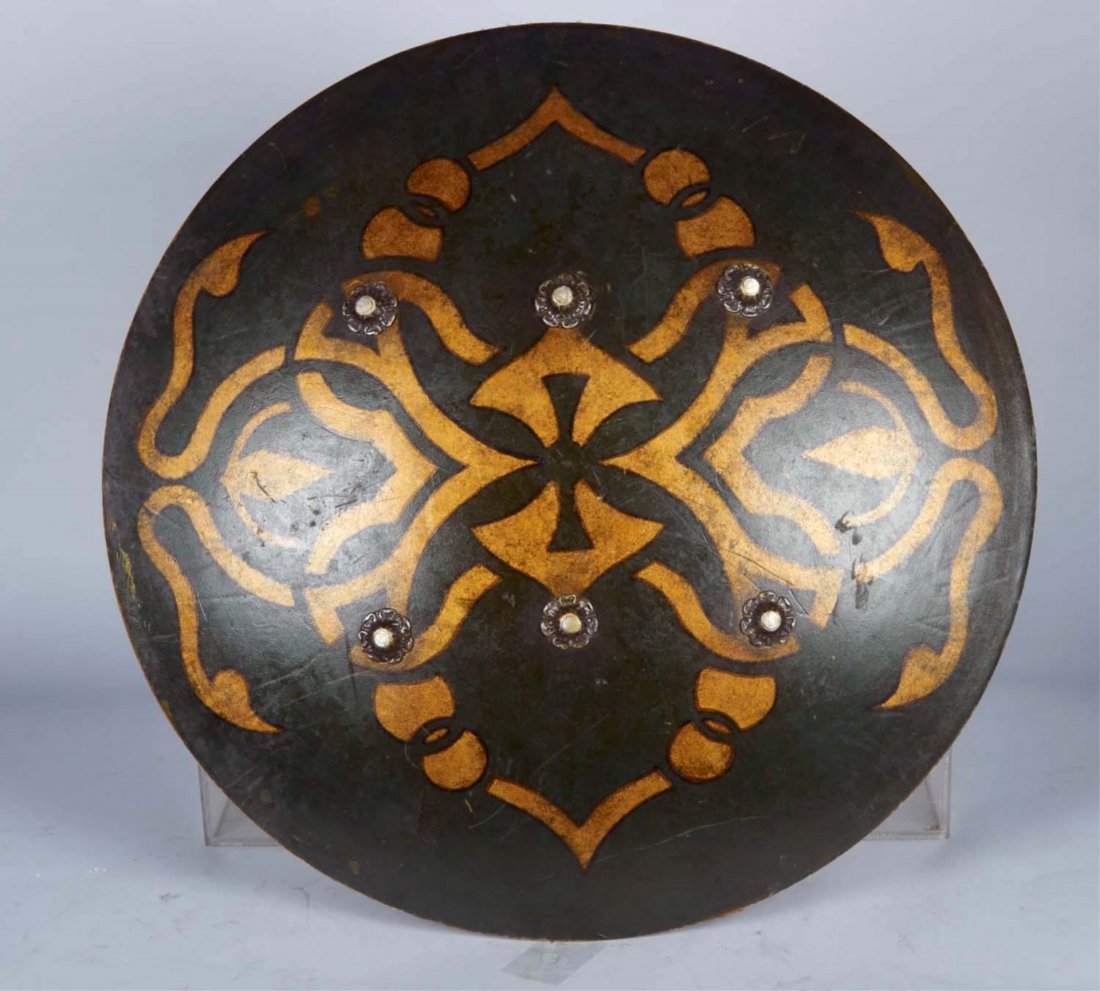 Prop Shield Used - Walt Disney's Prince of Persia: Prop Shield Used In Walt Disney's "Prince of Persia-The Sands of Time" (2010), Green Front w/ Gold Design & 6 Decorative Rivets, Suede Back w/ 2 Leather Straps, Includes Certificate of Authenticity Co