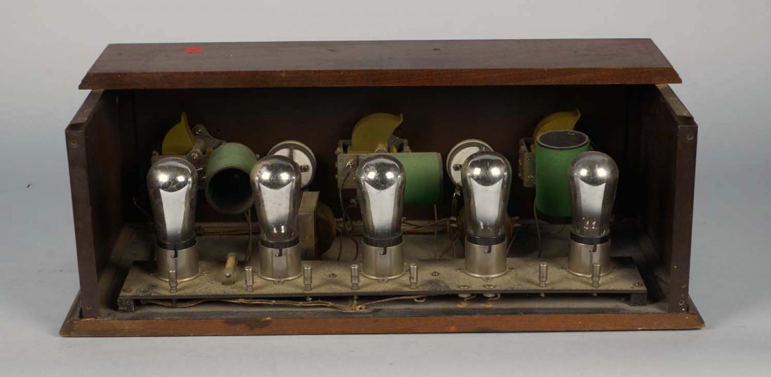 Stewart-Warner Atwater Kent Battery Radio: Model 300, in metal case with wooden top and base, volume and battery control, circa 1926. Includes schematic but is missing back door. Condition (Very good). Size 22" x 9.25" x 8"