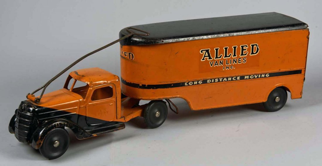 Pressed Steel Buddy L Allied Van Lines Moving Van: Pull-N-Ride toy in orange and black with 6 wheels and steering handle. In original condition. Condition (Very Good). Size 29-1/2" x 6-1/2" x 9-1/2"