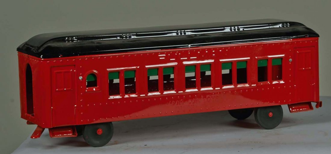 Pressed Steel Cor-Cor Toys Pullman Trolley Car: Restored in red with black top and rubber wheels. Condition (Restored). Size 24" L.