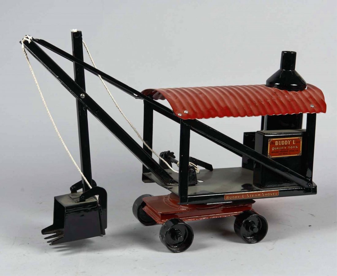 Pressed Steel Buddy L Steam Shovel: Restored in red and black with gold Buddy L decals on 4 wheel swivel base. Condition (Restored). Size 19" with shovel arm at rest.