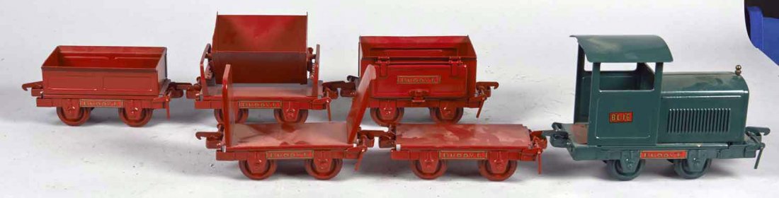Pressed Steel Buddy L Industrial Train Set: Includes green BL-16 engine, red gondola, rock, ballast, stake, and rocker dump cars. Condition (Restored). Size 47" x 3" x 6"