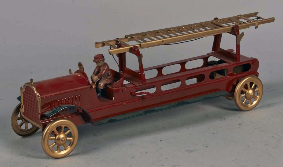 Pressed Steel Ladder Truck With Driver: Restored in red and green with gold ladder and spoke wheels. Patented in 1921. Condition (Very good). Size 19" L. to end of ladder.
