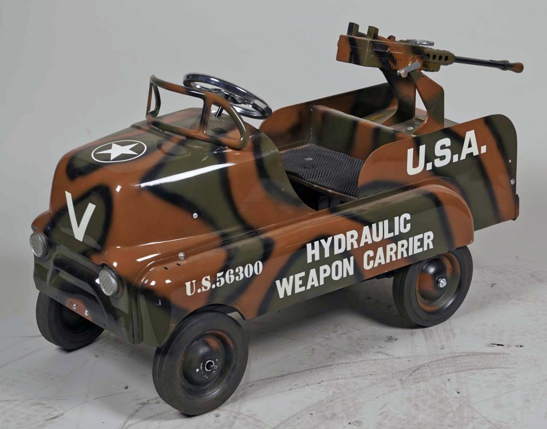 AMF/GMC Hydraulic Weapon Carrier Pedal Car: With Unit 5 Anti-Aircraft gun on back (turning handle initiates firing action). Camo paint with U.S. 56300 side decal. Condition (Very good). Size Approx. 40" x 13-1/2"