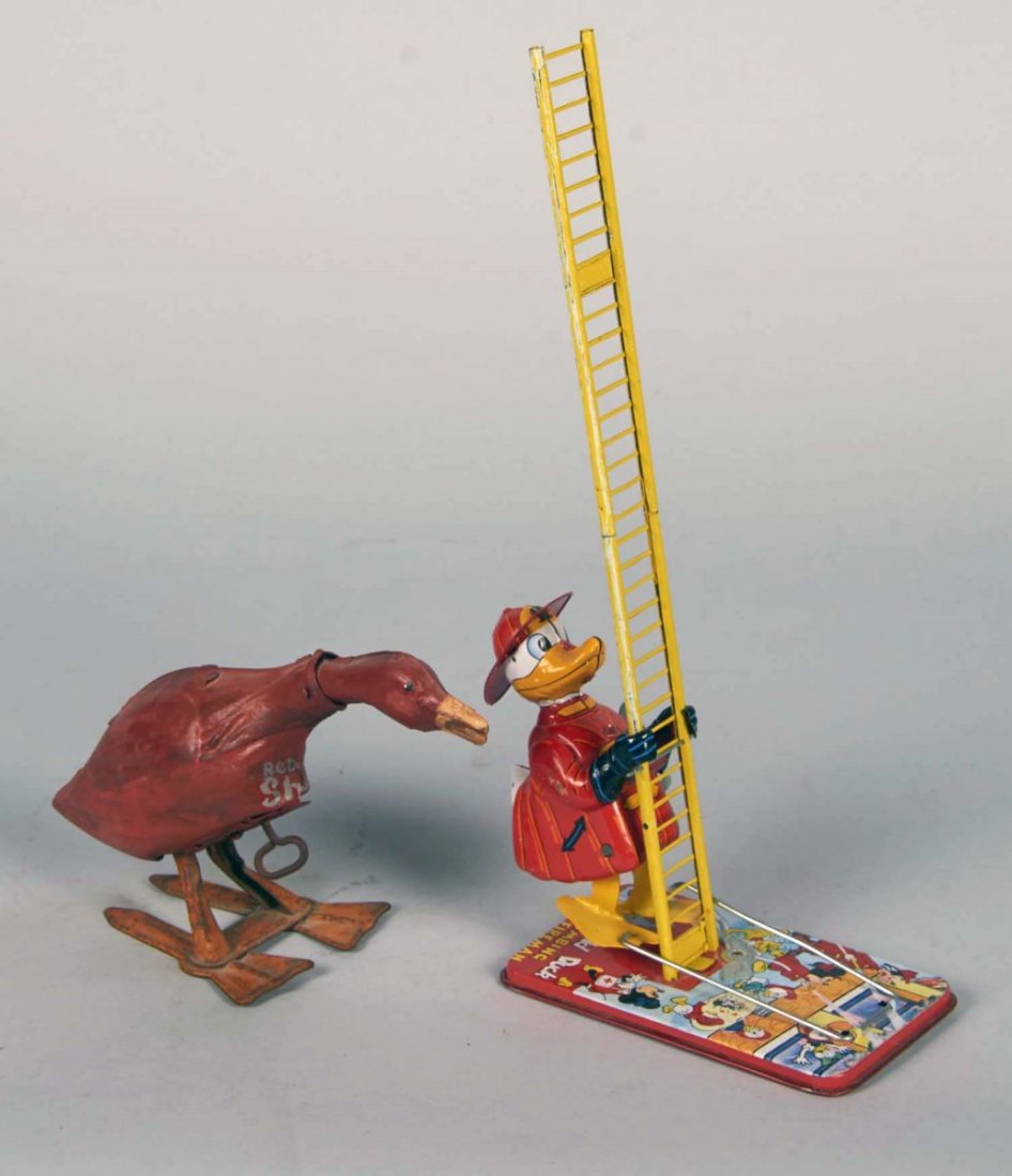 Lot Of 2 Wind-up Tin Toys: Donald Duck, Red Goose: Including 1- Tin litho Donald Duck Climbing fireman with great graphic of Walt Disney characters on the base- works c. 1950's, and 1- waddling and nodding red goose clockwork toy with older repaint jo
