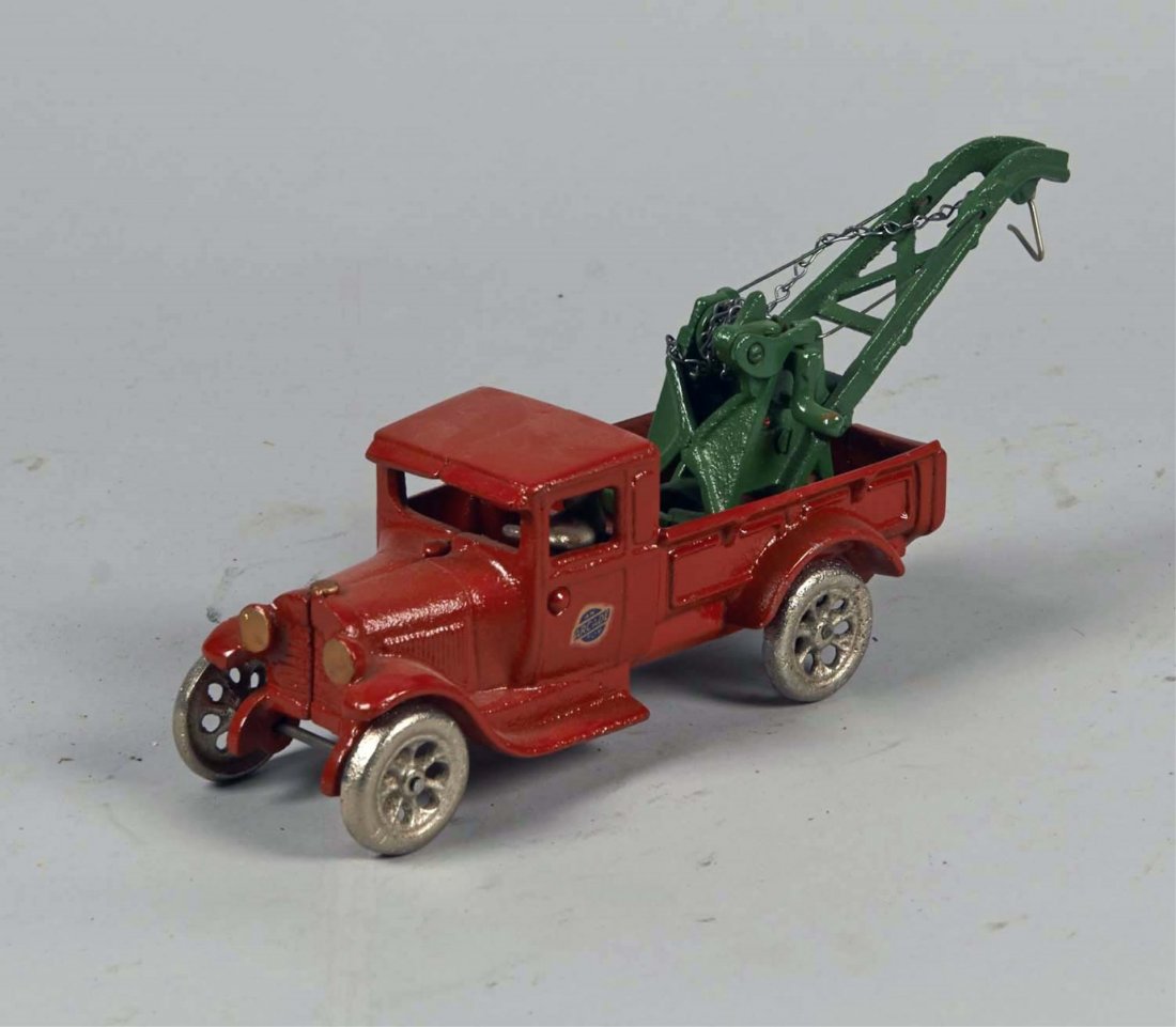 Cast Iron Arcade Wrecker: Has driver, silver wheels, red truck and green hoist. Stamped Arcade 2103 and has Arcade decal on driver door. Condition (Restored). Size 11" x 3" x x 3-1/4"
