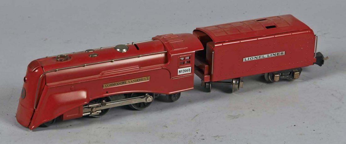 Lot Of 2: Lionel Lines O Gauge Train Cars: Pre - war. Commodore Vanderbilt engine no. 264E (9-1/2" x 3" x 3") and tender car (8" x 2-1/2" x 3"). Both are refinished in red. Condition (Restored). Size 9-1/2" x 3" x 3"