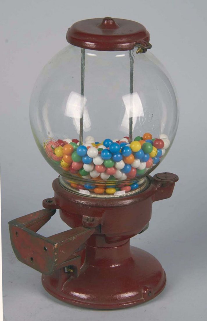 1 Cent Columbus Model A Gumball Vending Machine: Rare wall mount version, Red cast-iron base, Embossed Columbus glass globe c1930s w/ barrel lock & key Condition Very good Size 10-1/2" x 9" x 17"h