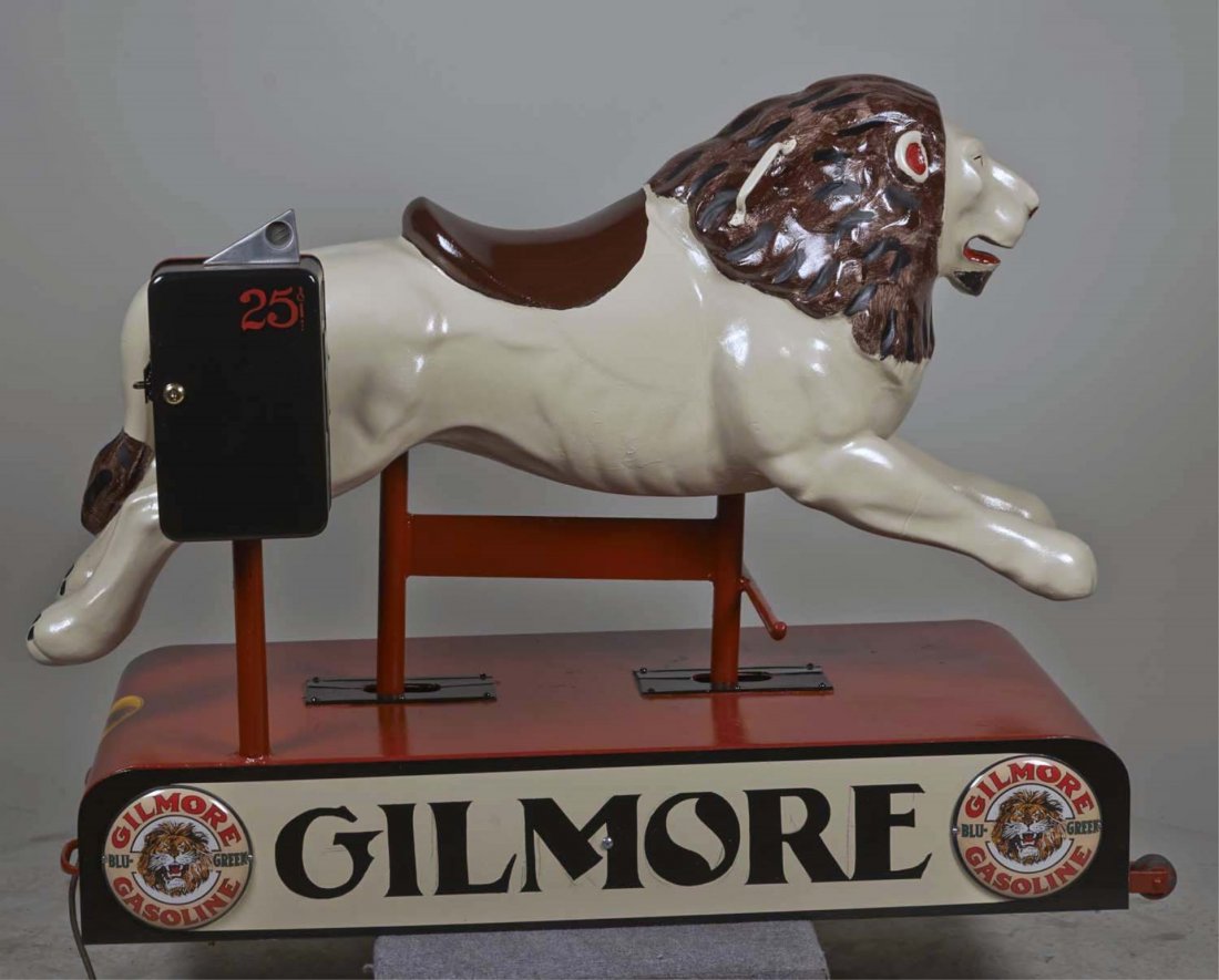 25 ¢ Gilmore Gasoline Lion Kiddie Ride.: Has "Roar With Gilmore" decals and "Gilmore Gasoline Blu-Green" round signs featuring lion logo. Base has wheels on one side for ease in moving. Recently restored and freshly painted. Works with keys.