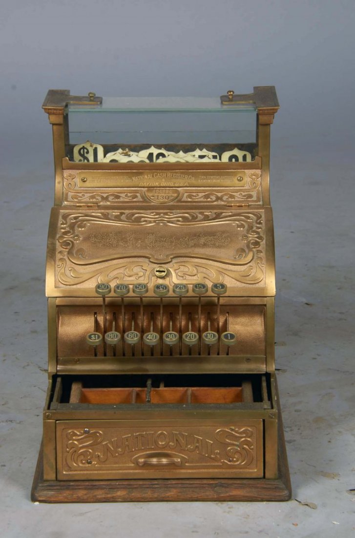 National Cash Register Candy Store Model 130: Serial No. 464894 circa 1905, Brass with Art Nouveau design, wood base, "National" drawer and blank space on front for name of owner/store. No marble shelf and back metal plate is not original. Workin