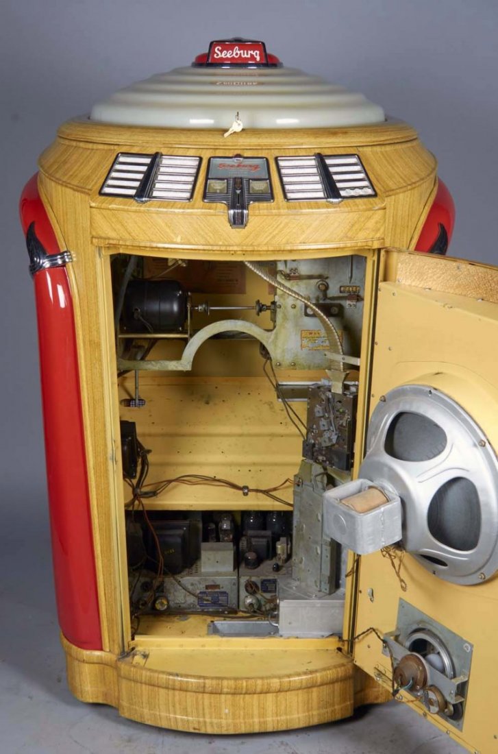 Multi-Coin Seeburg Symphonola Jukebox Model 148ML: Model 148ML Serial No. 170487 circa 1948. Jukebox accepts quarters, dimes, and nickels, plays 78 rpm records, features twenty selections, faux wood grained metal case, and has keys. In working conditi