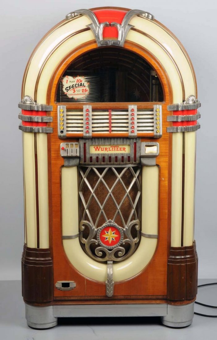 Wurlitzer Jukebox Model 1015 w/ Extrenal Speaker.: This lot includes the jukebox, matching round external wall speaker, and also the corresponding remote selector wall box. Appears complete and plays. Has problem with the coin mechanism. No key. In ve