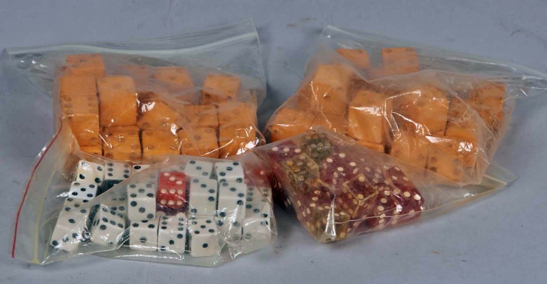 Lot Of Dice.: Lot including shaved and trimmed red celluloid cheating dice with separate extra dice spots (Flat 4-3), White dice and backgammon dice. Condition (Fair). Size 5/8".