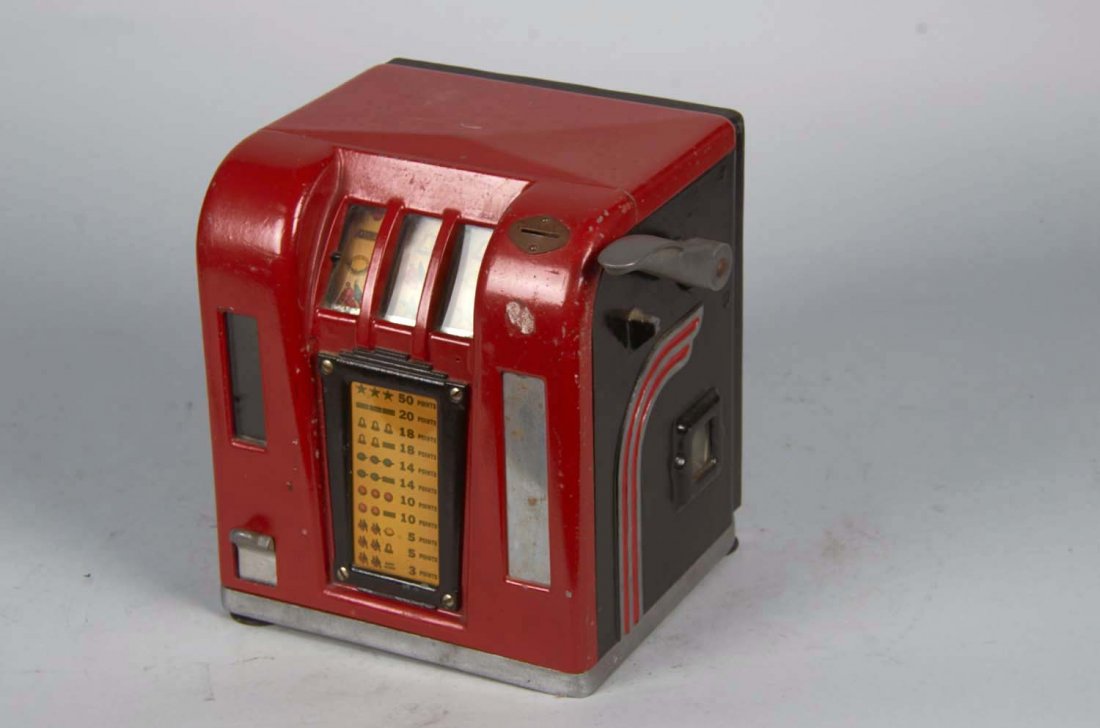 Coin-Op Groetchen Zephyr Trade Stimulator.: Three-reel red metal countertop cabinet with gum ball vendor circa 1937. Includes key. Condition (Very Good). Size 10" x 8.75" x 8.25"