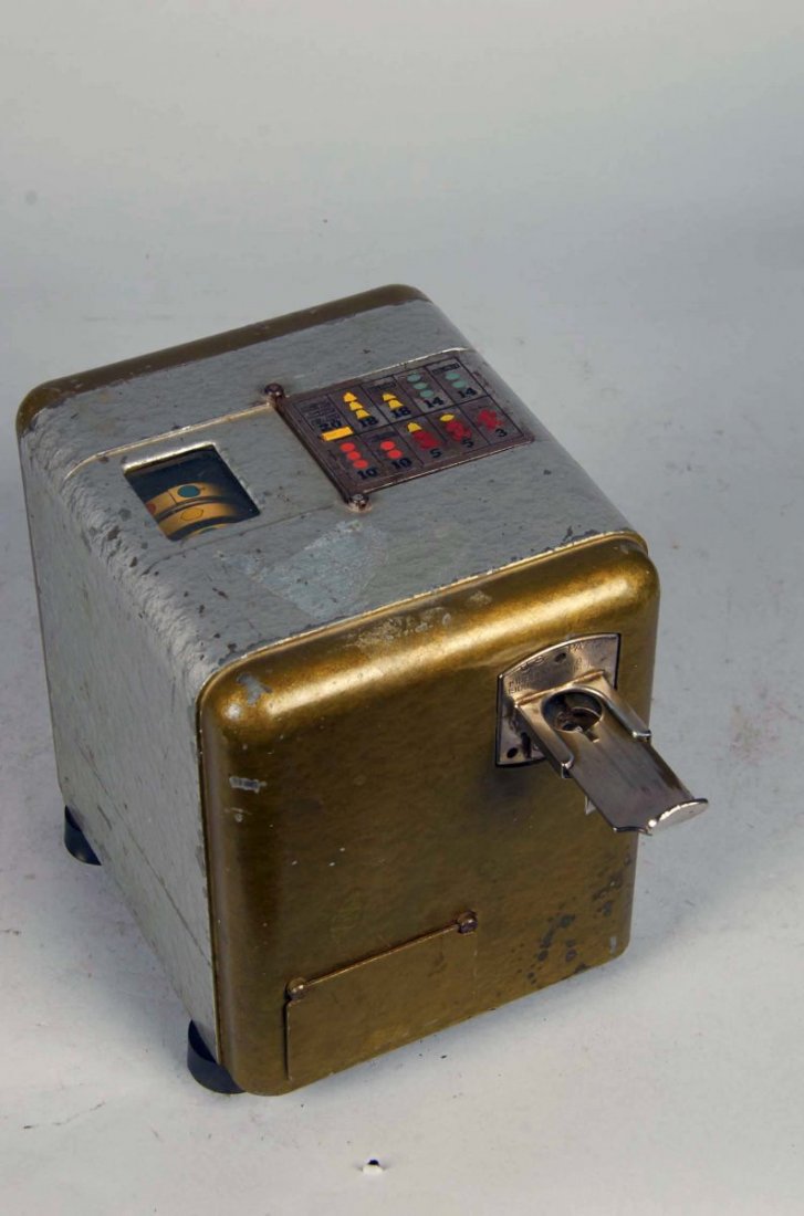 Coin-Op Mills Vest Pocket 3-Reel Miniature Bell: Slot machine is olive and silver with some chips throughout. Model circa 1938 is not presently playing. Includes key. Condition (Good). Size 9" x 7" x 8"