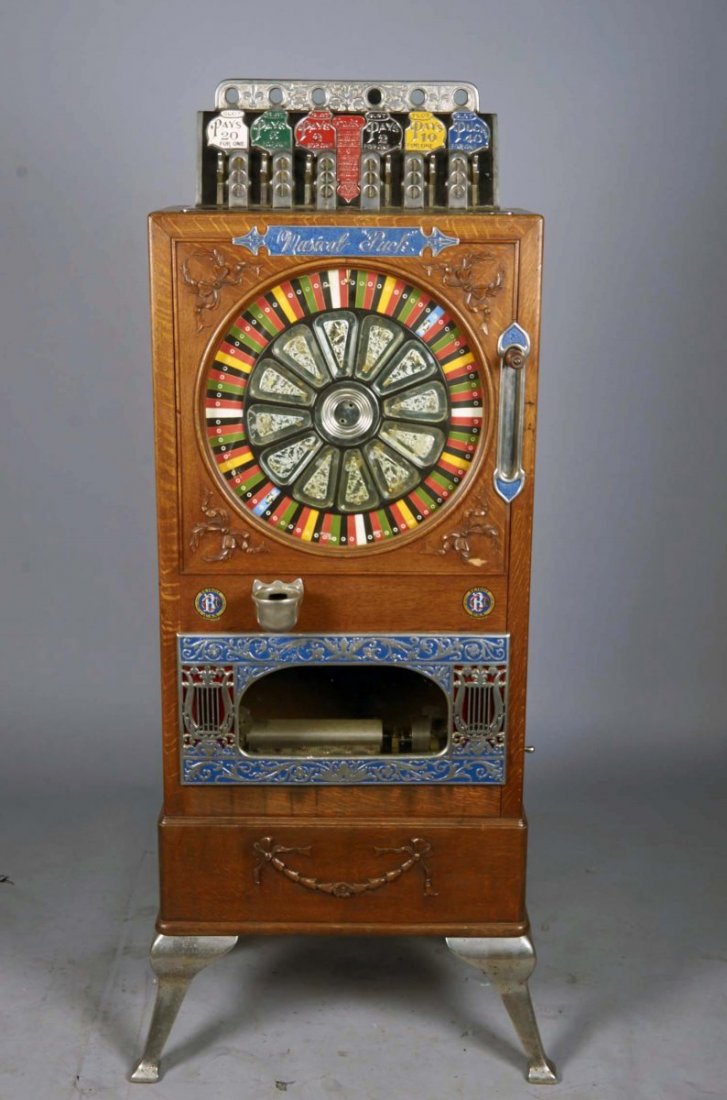 5 ¢ Caille Musical Puck Upright Slot Machine.: 5 ¢ Caille Musical Puck upright floor model slot machine c1900. This machine is a nice older restoration that plays and pays. Wheel speed pump will need adjustment and music start linkage is not corr