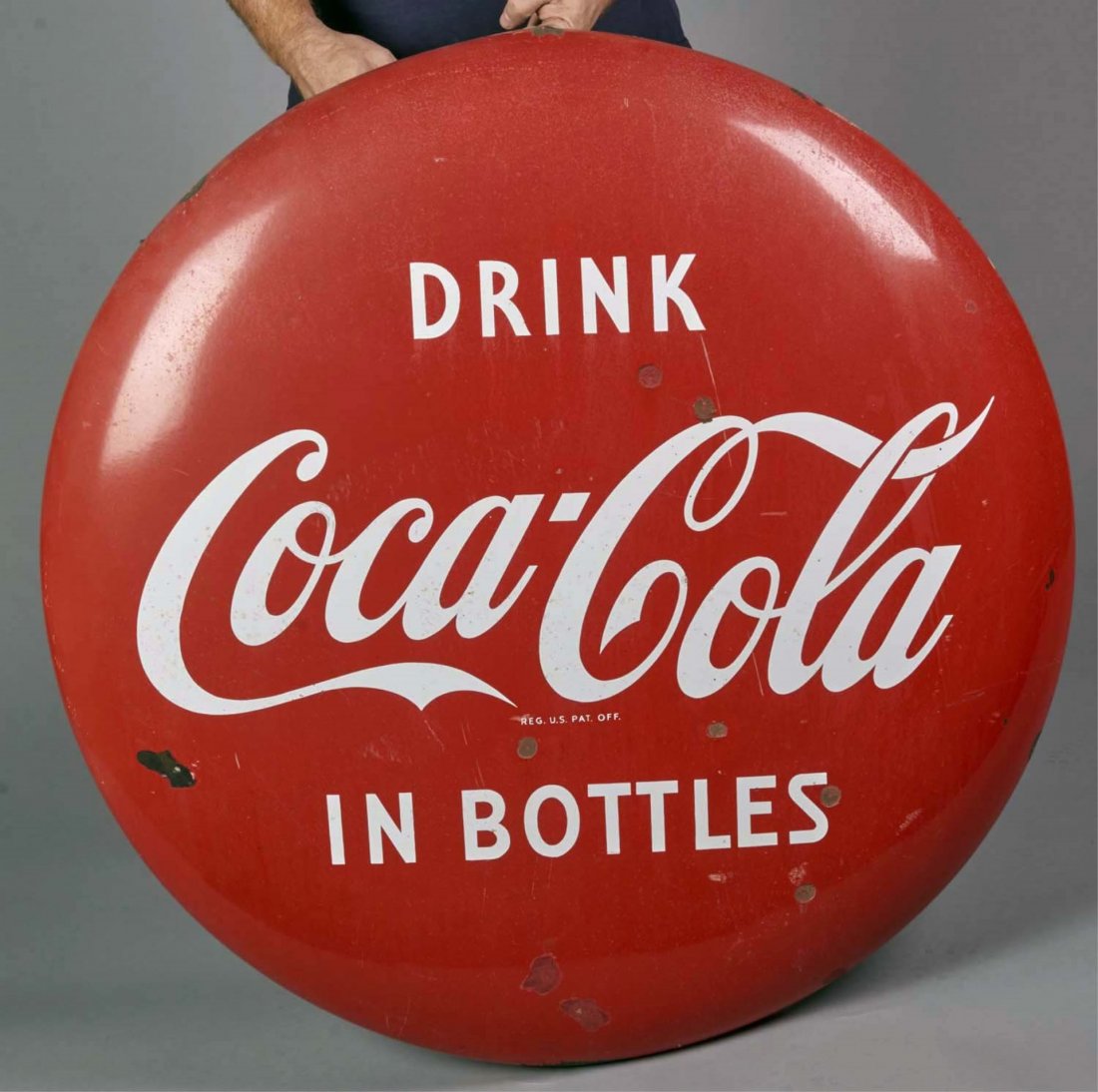Drink Coca Cola In Bottles Porcelain Button Sign: Circa 1950s. Condition (Fair). Size 36" d.