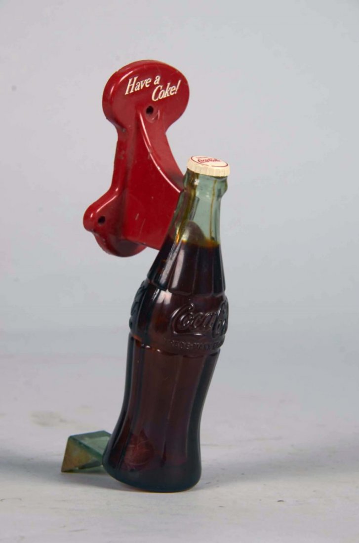 Coca Cola Bottle Shaped Advertising Door Handle: Plastic and metal "Have A Coke!" slogan door pull handle, Back marked; Milton Sturm & Company Chicago 10 Ill., circa 1950's. Condition (Excellent). Size 8" tall