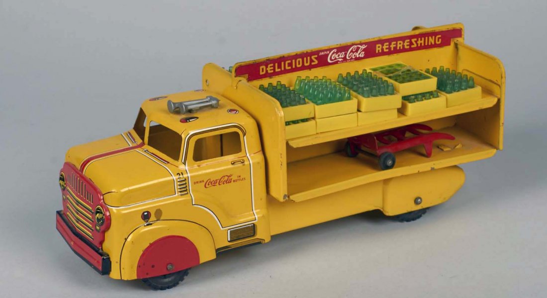 Marx Metal Litho Coca Cola Delivery Truck.: Double level open bed toy truck with 4 plastic tires includes 15 miniature cases of green Coca Cola bottles and one red hand truck. Feels like thick tin or pressed steel. Circa 1954. Condition (Very g