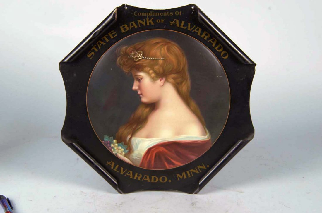 State Bank of Alvarado Minn. Rolled Edge Ad Sign: Early tin litho sign featuring a great color graphic of an auburn haired woman named Rosamond from Minnesota. Marked; "Copyright 1907 The Meek Company 81". Some outer bending and edge ding, displays w