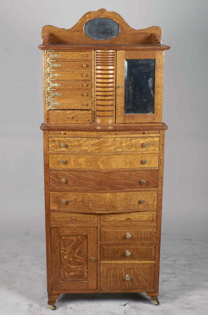 Tall Locking Antique Oak Dental Cabinet: Features front compartments for drill & tool storage with key, swivel drawers and includes framed bill from 1911 Dr. to R. Houston Dentist, drawers unlock with a 'trick". Made by the Ransom and Randol