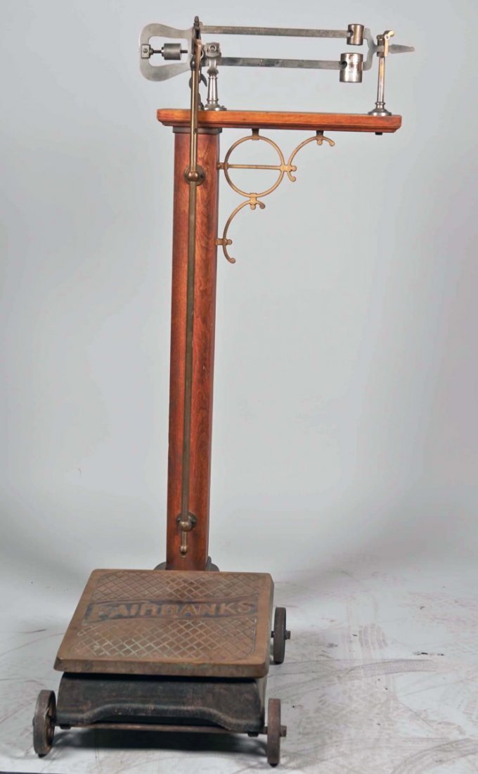 Early Fairbanks Floor Beam Scale On Wheels: Early Fairbanks No. 11 1/2 Floor Beam Scale On Wheels, Wood column w/ metal & brass parts, Made in USA 03. Condition Excellent Size 20" x 34" x 58"