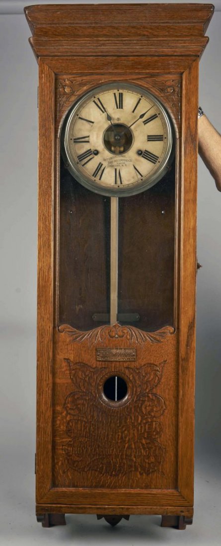 Bundy Time Recorder Wall Clock with Pendulum.: Early Time Clock made of quartersawn oak with glass intact and front maker's plate. It is in excellent working condition with the original mechanism and key, but missing the lower mechanism. Condition