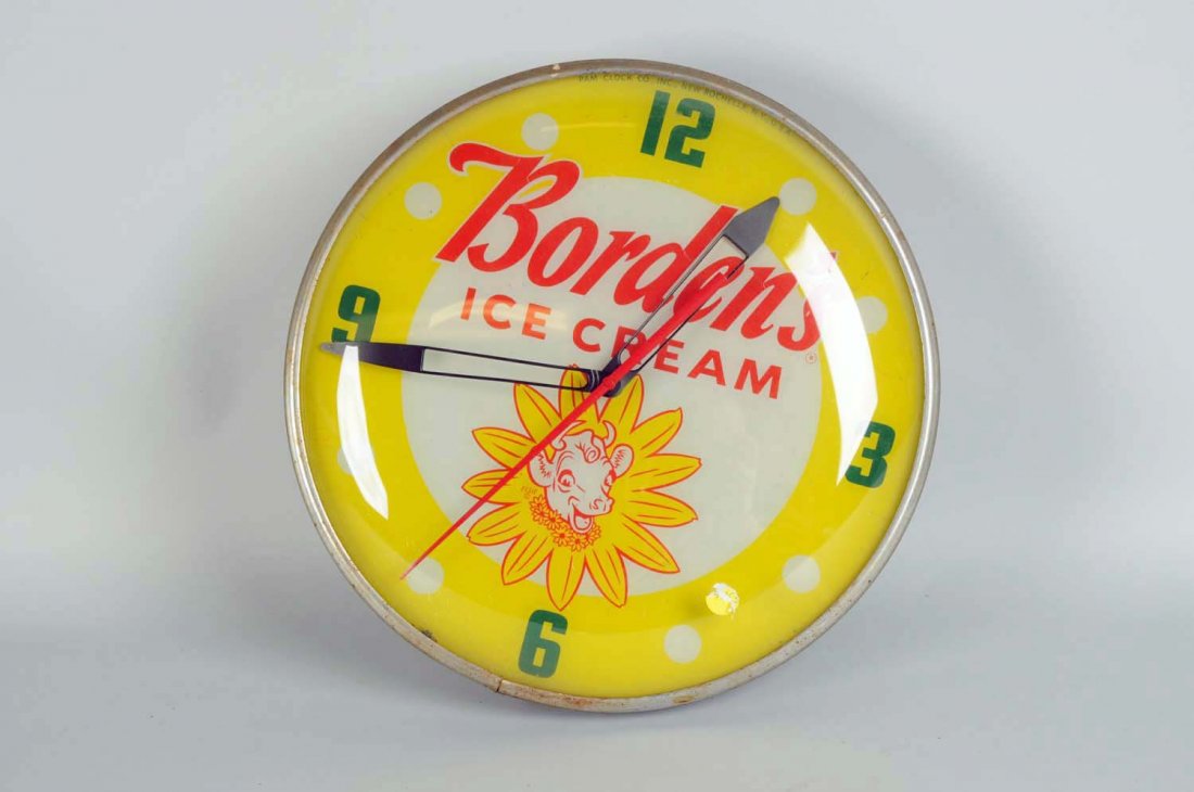 Borden's Ice Cream Round Lighted Wall Clock: Clock face features Elsie (Borden Dairy Co. mascot), glass dial cover on metal back, by Pam Clock Co. stamped Feb. 1959. All original clock works and lights up. Face has very light crazing at the bott