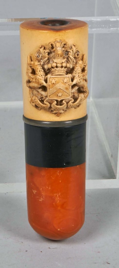 Lot of 2: Meerschaum Items.: Lot includes: a cigar holder featuring ornate "Labore et Honore" coat of arms crest with seven balls and three feathers cresting a helmet of the Duke of Windsor, and an ornate cigarette holder featuri