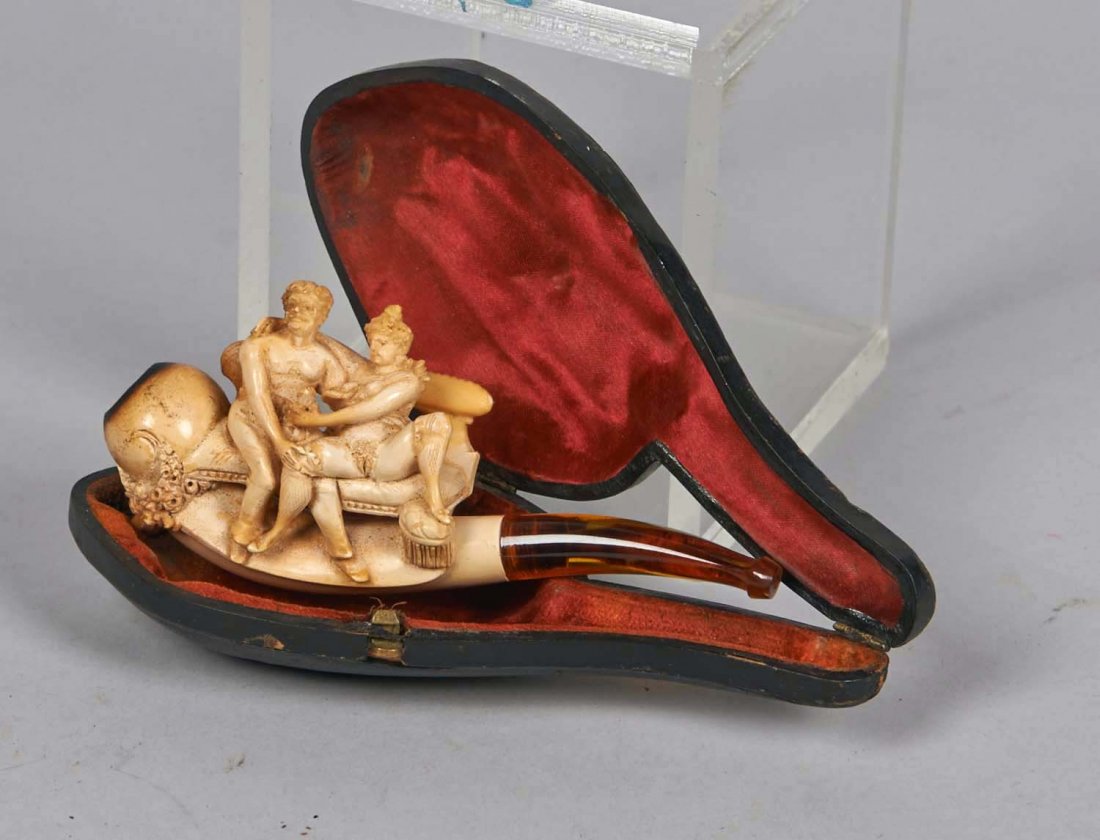Lot of 2: Meerschaum Naughty Pipes.: Lot includes: Risque scene with man and woman on bench pipe in case, and a hand holding woman's nude body (bottom half only) by the legs pipe with removable bowl insert in case marked "Genuine Meersch
