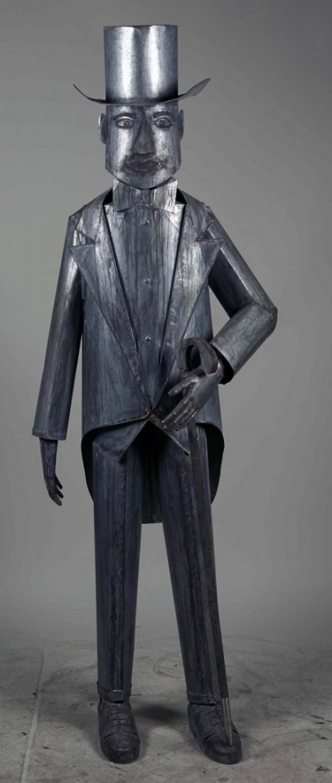 Life Size Sheet Metal Figural Man Statue.: Man is wearing bow tie, top hat, suit and carries a cane, details in face, buttons, and shoe laces, patina effect throughout. Condition (Excellent). Size 73" T.