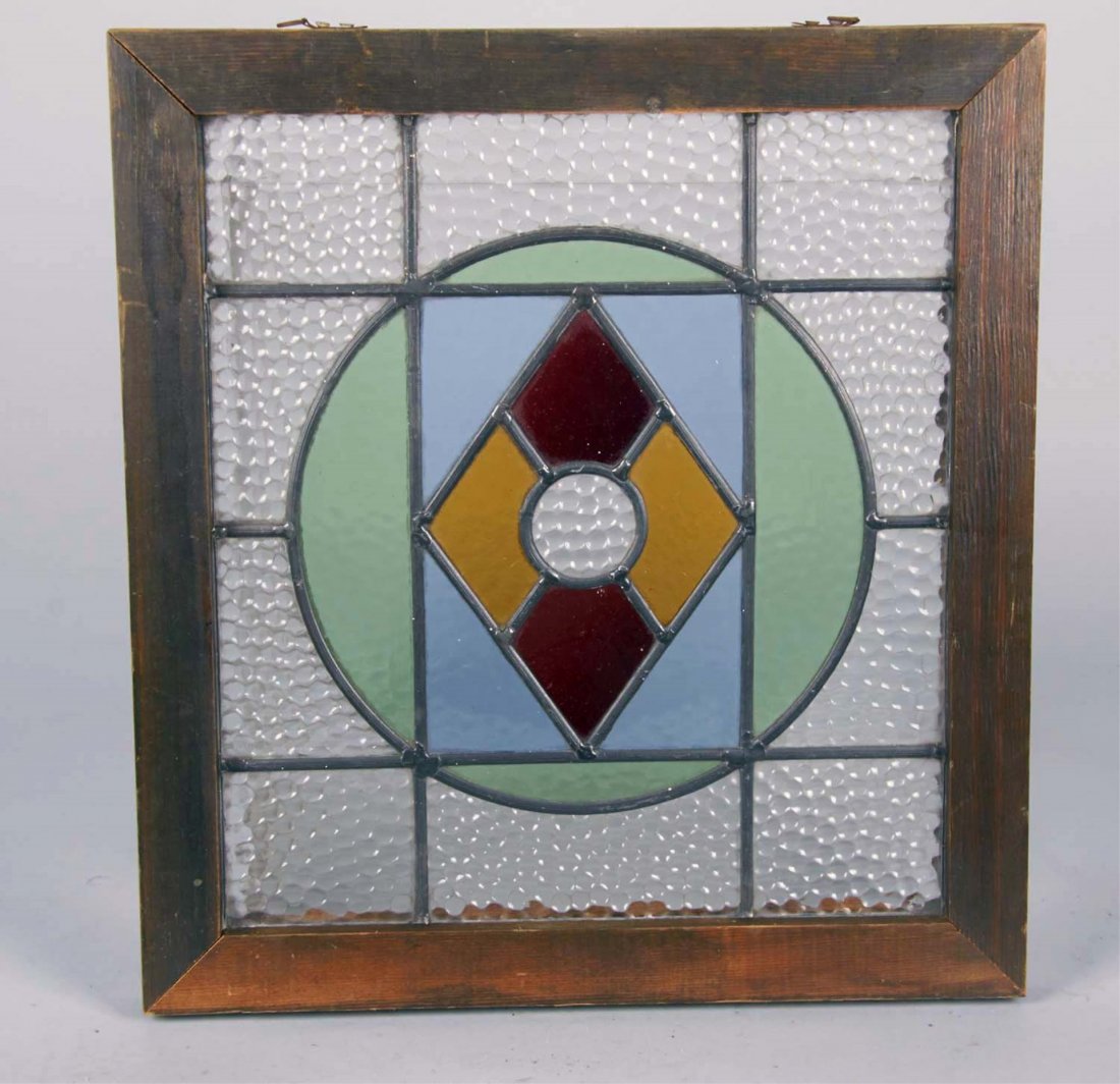 Lot Of 2 Leaded Stained Glass Window Panels: Both in wood frames: 1 - Cathedral glass circle around diamond shape center w/ clear bubble outer pieces(16-3/4" x 18" x 1-1/2") & 1 - Cathedral glass w/ diamond shape center design, broken & loose se
