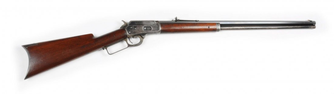 Marlin Model 1889 Lever Action Rifle.: Serial # 26374 This is a special order rifle in that it features a 28" full octagon barrel (4" longer than standard). It has a full magazine, rifle butt, blued finish, and walnut stock. The barrel ret